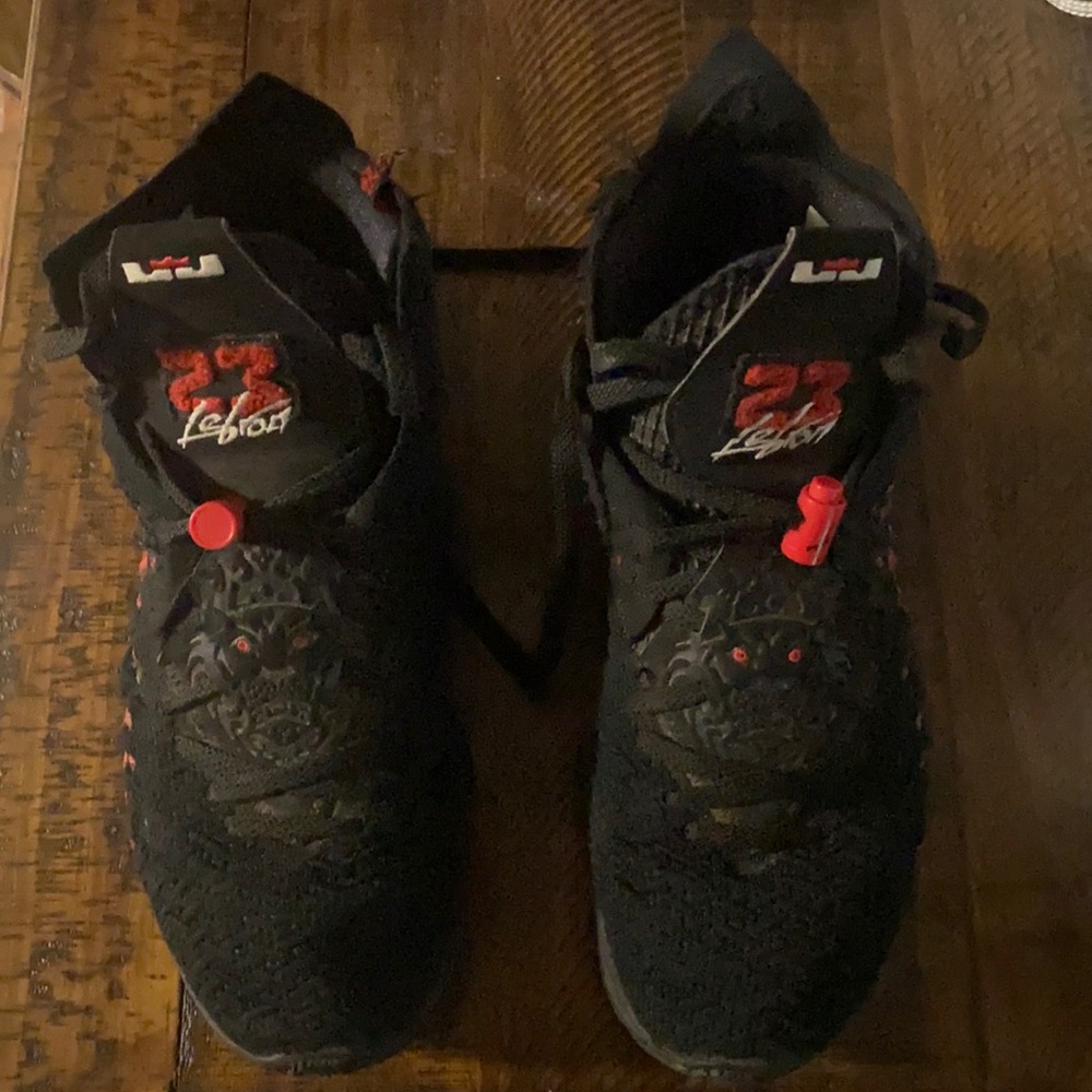 Black and red lebron shoes